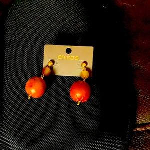 Gold dangle earrings with brown balls.